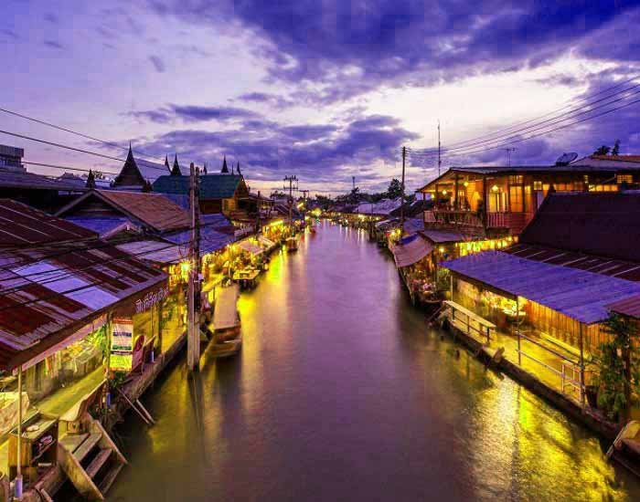 Thai canal scenes with traditional houses